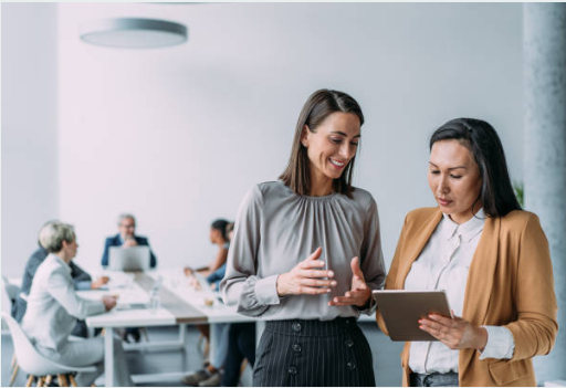 Image of two business professionals discussing documents