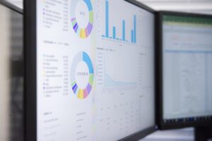 Computer screen showing colorful charts indicating an analysis of information.