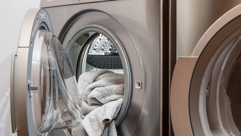 Front-loading washing machine with its door open and laundry inside