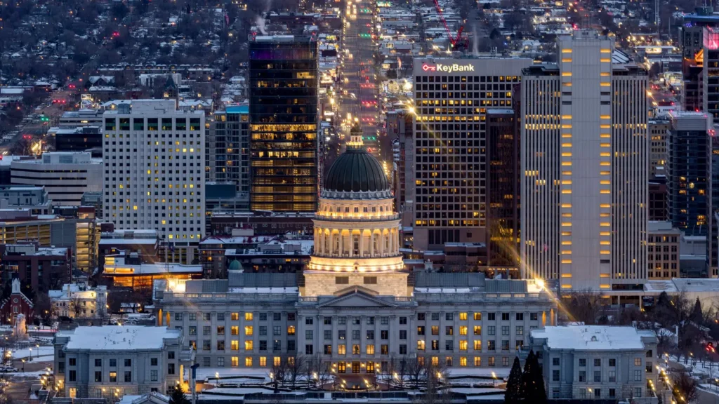 Salt Lake City skyline and Utah State Capitol lit up at dusk